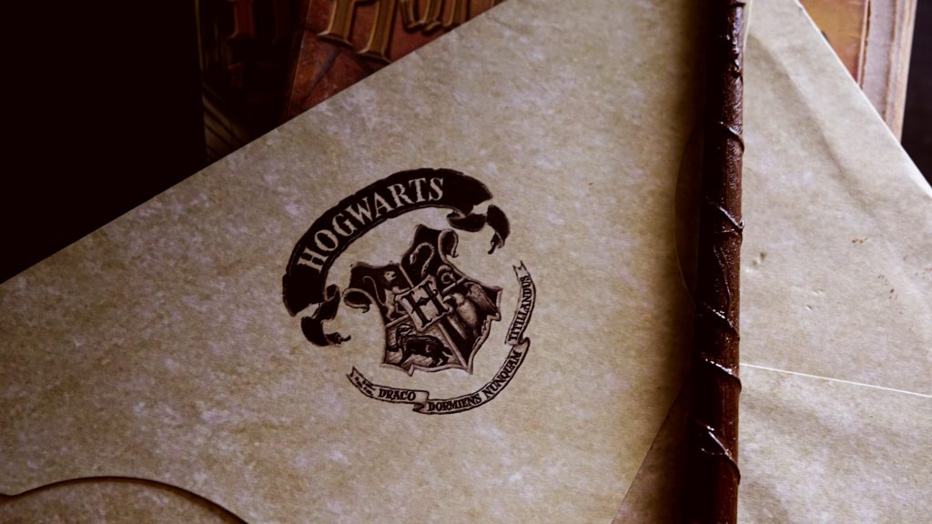 The Hogwarts School logo from the book and movie franchise, Harry Potter. 